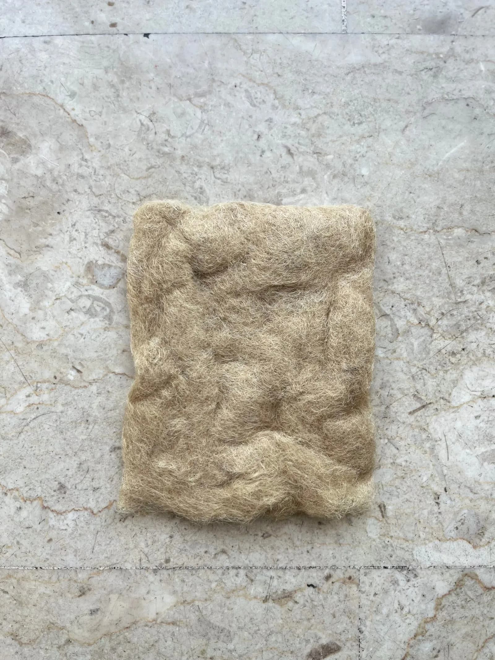 A pad of cottonised linen fibre